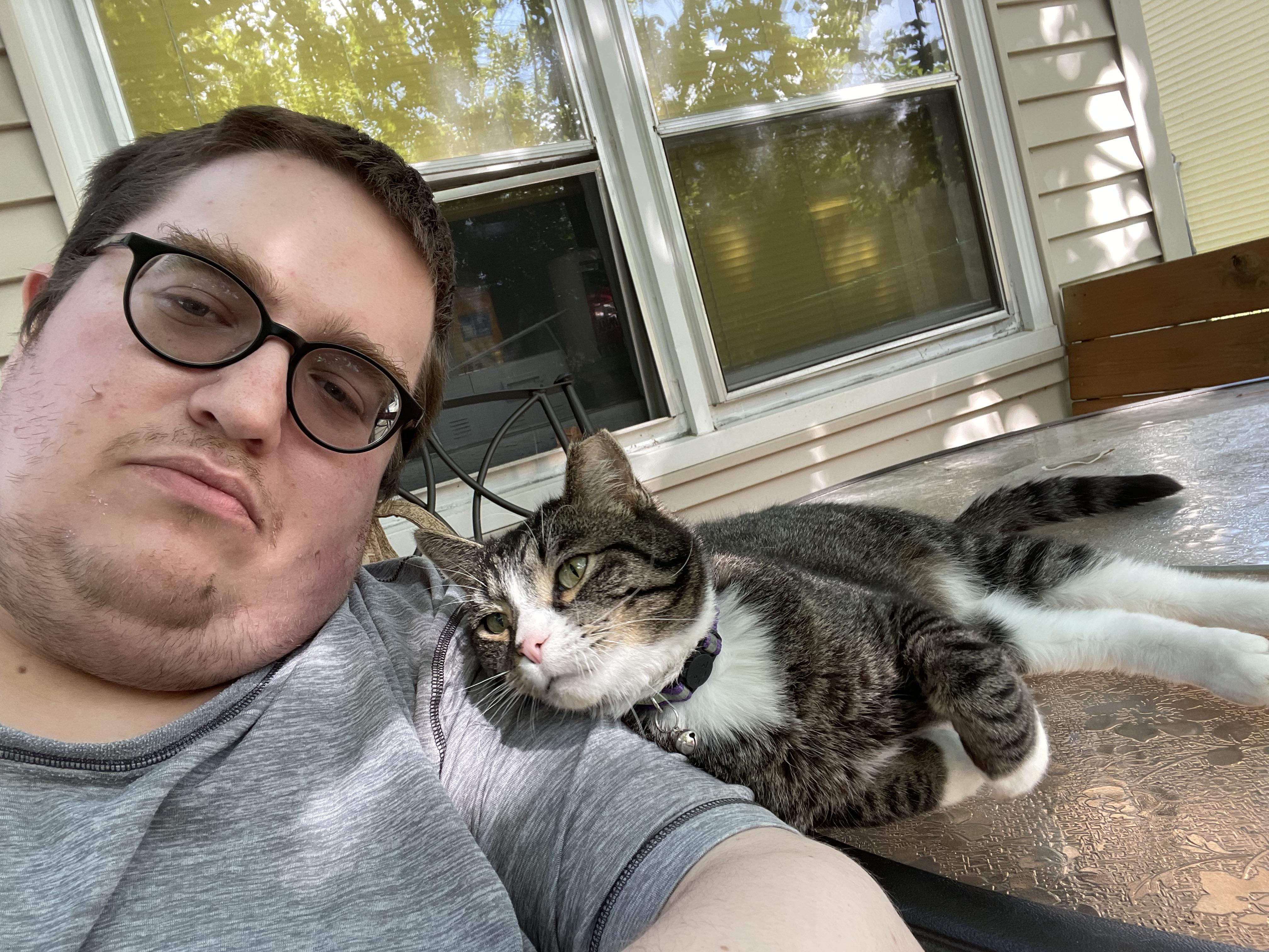 My cat and I enjoying the summer day together.
